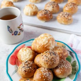 stuffed bagel bites on a plate with tea in the background